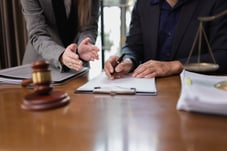 Attorneys reviewing paperwork