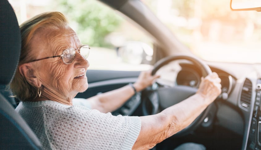 Senior driver behind the wheel showcasing car accidents caused by elderly drivers.