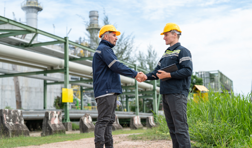 A picture of two men agreeing on an oil and gas lease.