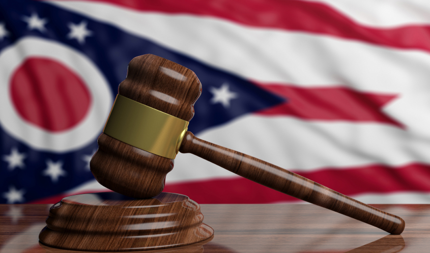 Business law in Ohio represented by a gavel and Ohio flag.