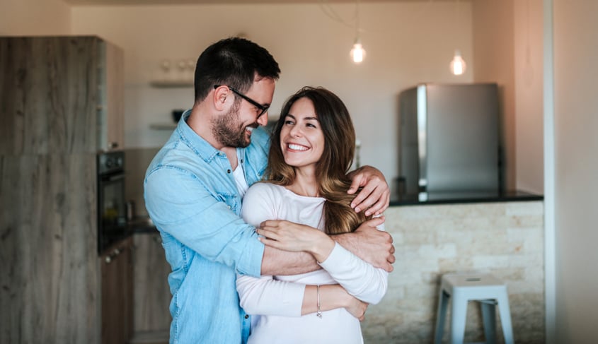 A happy married couple consider a postnuptial agreement.