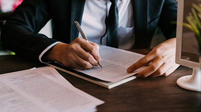 Attorney writing in notepad Attorney writing in notepad