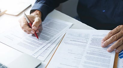 Businessman signing paperwork