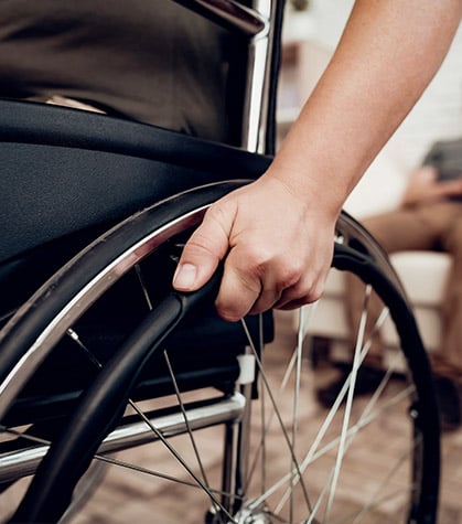 Close up of man using his wheelchair