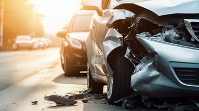 Close up of vehicle with a smashed front end