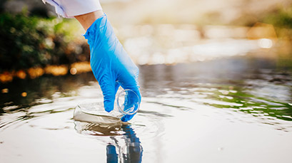 Environmental scientist taking a water sample