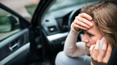 Woman calling a car accident lawyer