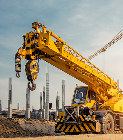 Industrial equipment with a crane behind it