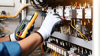 Man working with electrical equipment Man working with electrical equipment