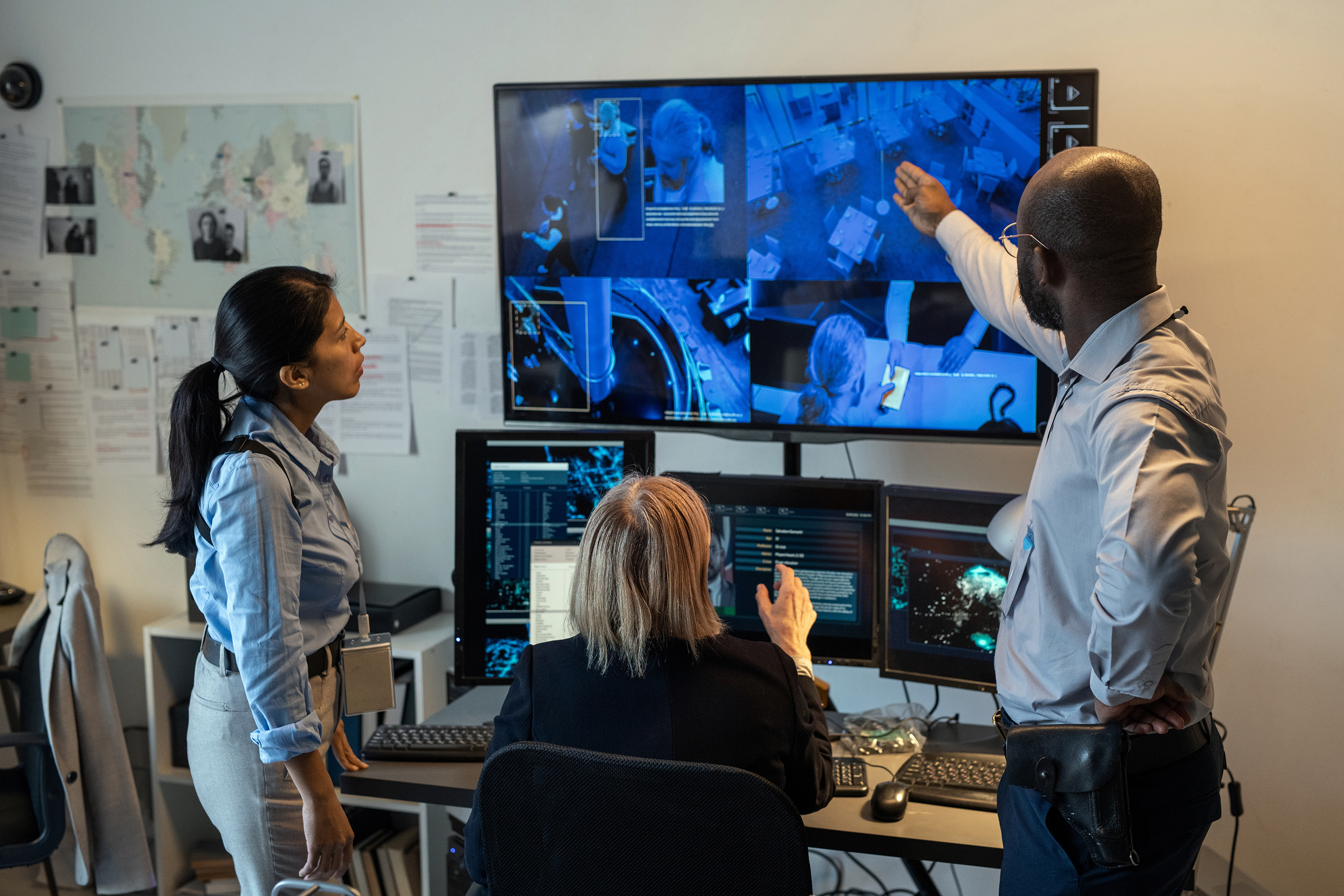 Security team reviewing camera footage