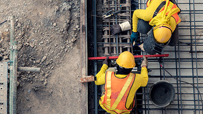 two construction workers on a job site